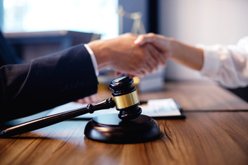 lawyer and gavel and shaking hands