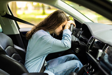 girl sad in front seat of car