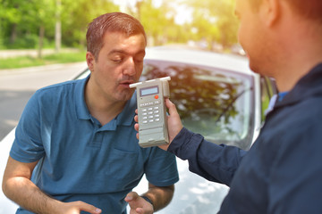 man doing breathalyzer