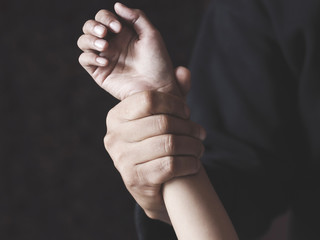 hand gripping arm domestic violence